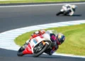 Pembalap Honda Team Asia bernomor 9 melaju melewati tikungan lintasan