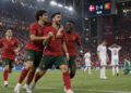 Ilustrasi pemain Portugal merayakan kemenangan atas Denmark